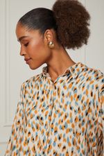 52051443_36156_4-CAMISA-OVERSIZED-MANGA-LONGA-DETALHE-AMARRACAO-NAS-LATERAIS-ESTAMPADA